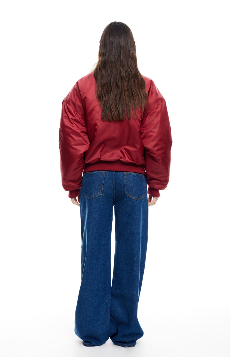 Rear view of a mulberry oversized puffer jacket with ribbed hem and cuffs