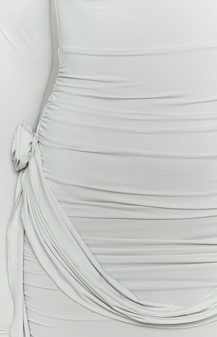Close-up of the grey mini dress's ruched side with a gathered fabric rosette detail at the hip
