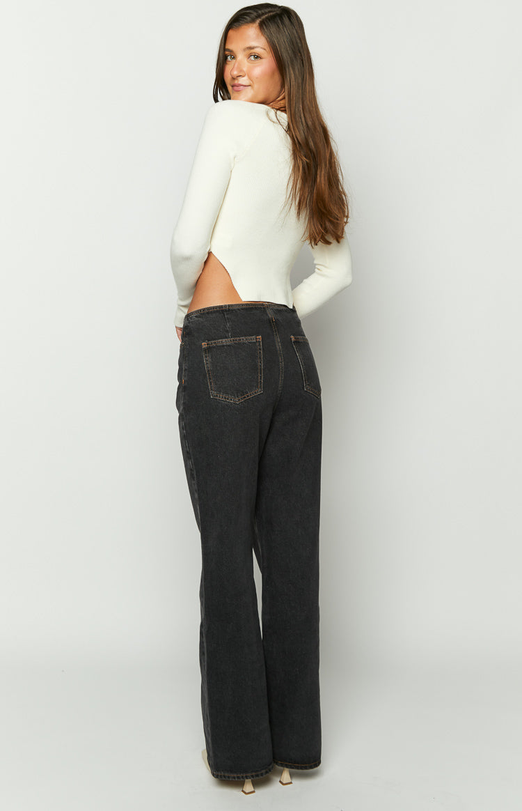 Rear view of charcoal wide-leg jeans with visible back pockets and high waist