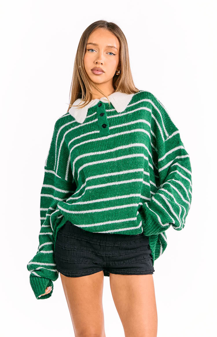 Forest green and white striped knit jersey with a white collar, black button placket, and relaxed oversized fit