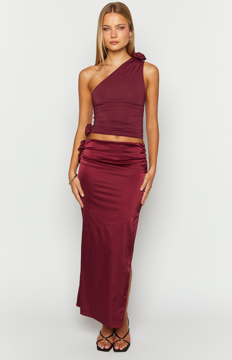 Burgundy satin maxi skirt with ruched side detail and a high side slit