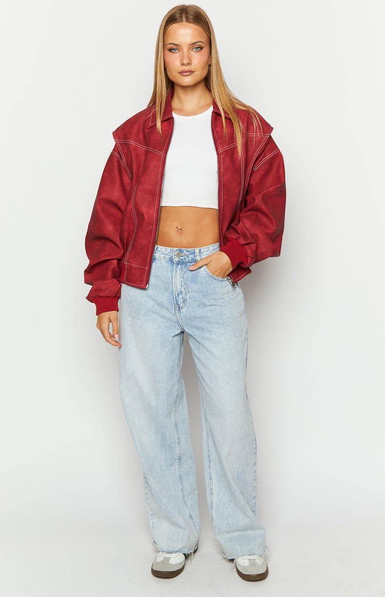 Front view of a crimson red bomber jacket with a washed finish, white contrast stitching, and ribbed cuffs