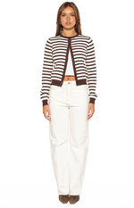 Front view of a chocolate and white stripe round neck cardigan worn open, showing the cropped fit