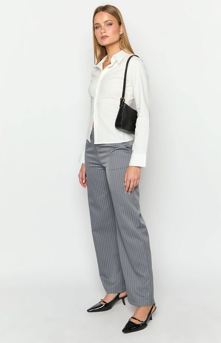 Side view of grey pinstripe wide-leg pants with a relaxed fit