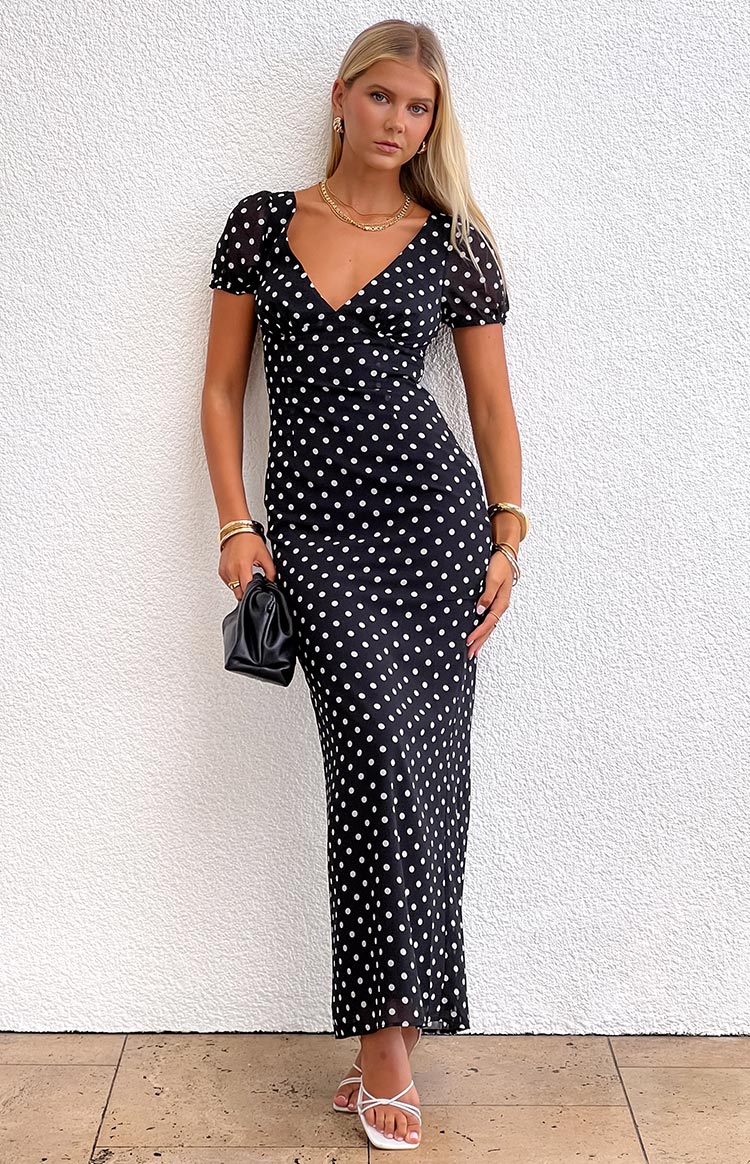 Beginning Boutique Lovella Black Polka Dot Maxi Dress black polka dot maxi dress with a V-neckline, short puff sleeves, and a flowing skirt