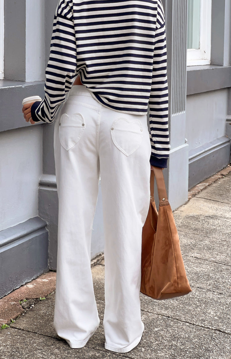 Beginning Boutique Lovers Lane White Denim Heart Pocket Slouchy Jeans white denim slouchy wide-leg jeans with heart-shaped ba