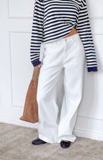 Front view of white denim slouchy jeans with a wide leg and relaxed fit
