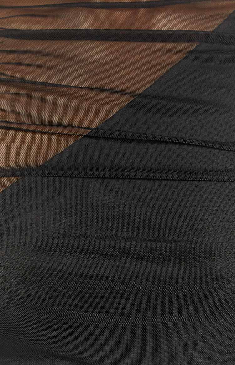 Close-up of the black mesh fabric with ruched details and sheer panels