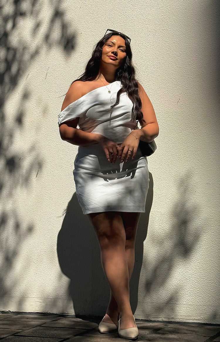 Beginning Boutique Lucas White Mini Dress white one-shoulder mini dress with draped detail and a fitted silhouette