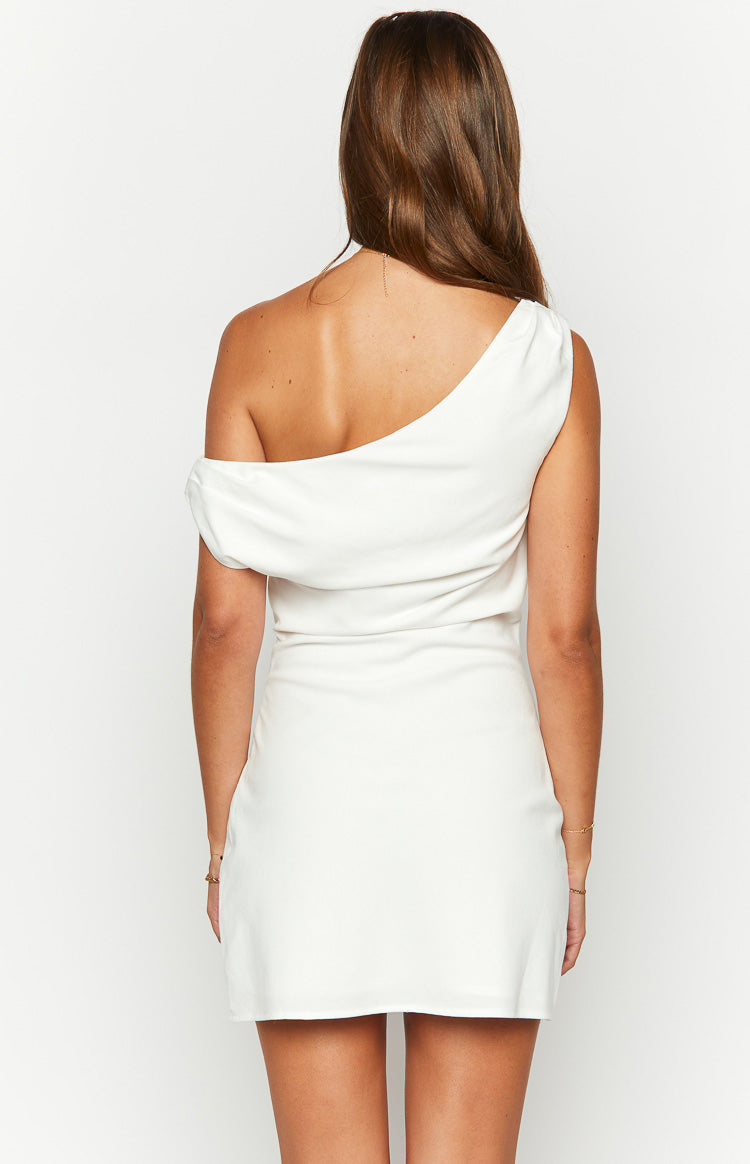 Rear view of a white one-shoulder mini dress with a draped detail on the left shoulder