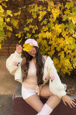 Beginning Boutique Luella White Flower Knit Cardigan cream chunky knit cardigan with 3D pink floral appliqués and balloon sleeves