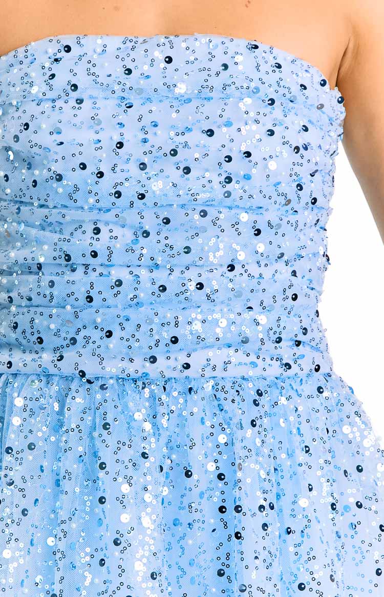 Close-up of the light blue sequin strapless mini dress showing the ruched bodice and gathered skirt