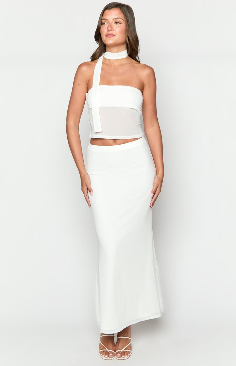 White maxi skirt with a smooth fabric, fitted through the hips and a subtle A-line flare