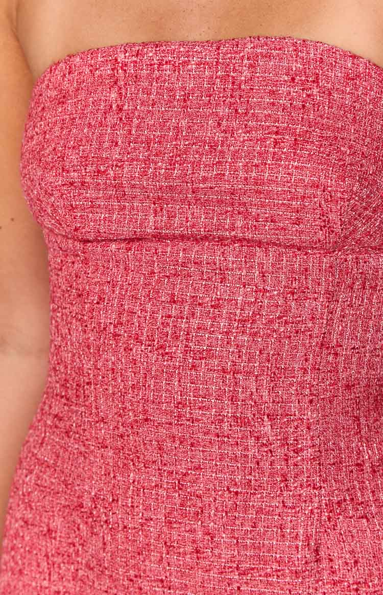Close-up of the textured red tweed fabric showing the strapless neckline and fitted bodice of the mini dress
