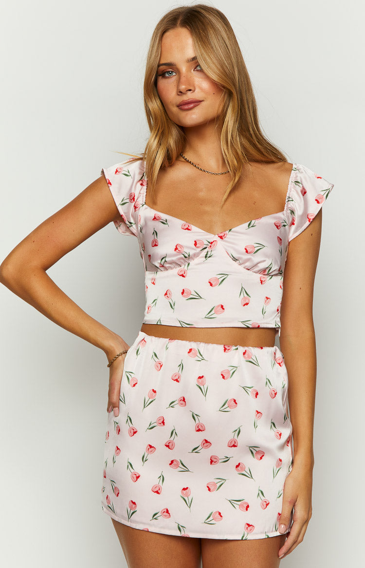 Beginning Boutique Maeva Pink Satin Tulip Print Top pink satin cropped top with tulip print, sweetheart neckline, and short cap sleeves