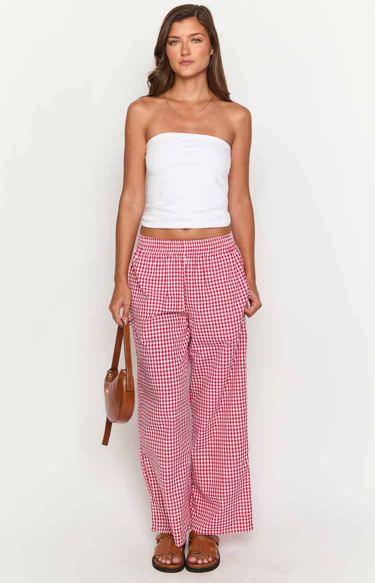 Red gingham wide-leg pants with an elasticated high waist and a relaxed, flowy fit