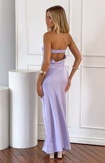 Rear view of a lilac strapless maxi dress with a shirred elastic back and a low cowl drape