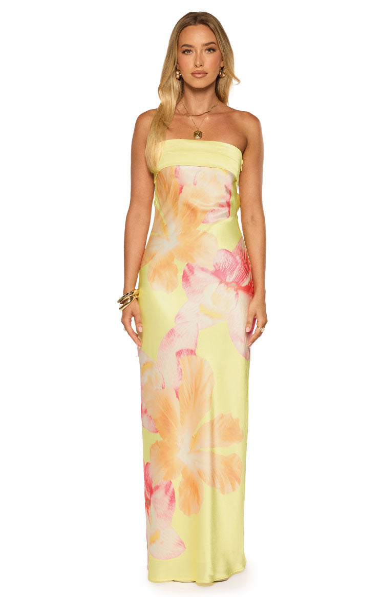 Yellow strapless maxi dress with a bandeau top and large pink and orange hibiscus floral print