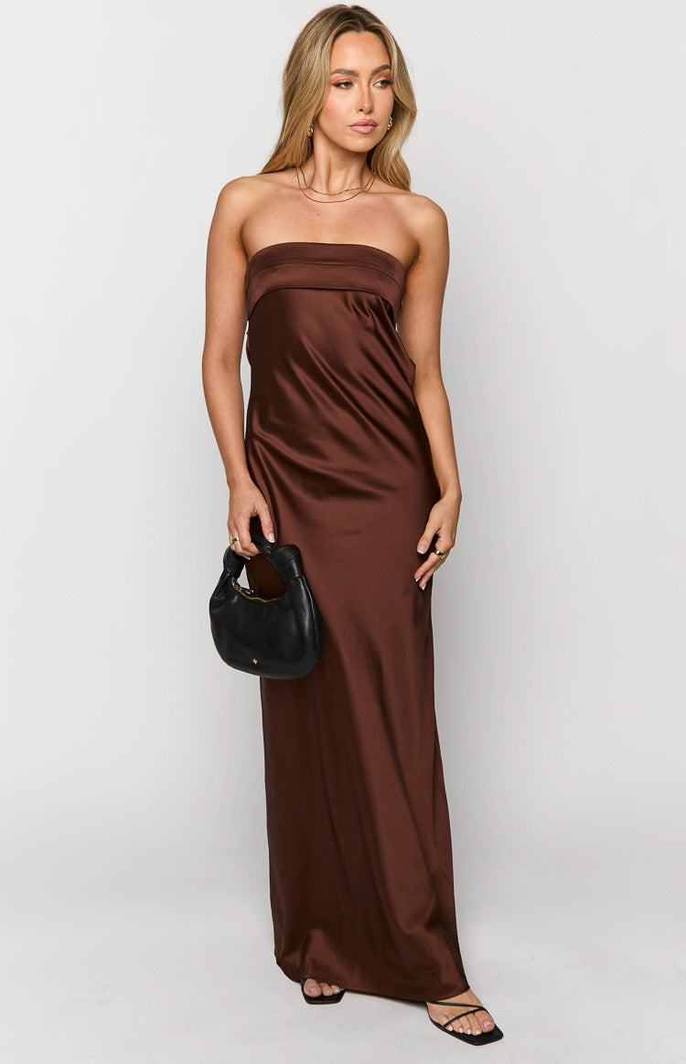 Front view of a brown strapless maxi dress with a smooth satin-like fabric and flowy silhouette