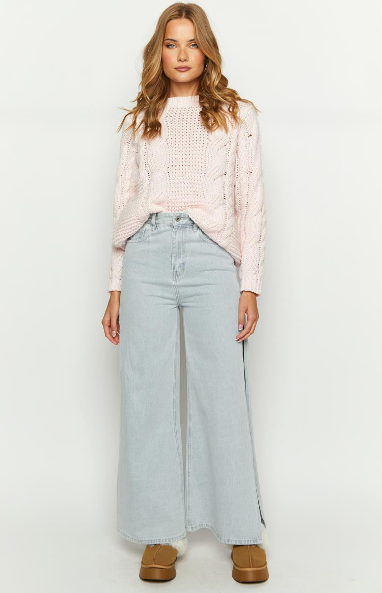 Light denim wide leg jeans featuring a subtle side split detail on the outer leg