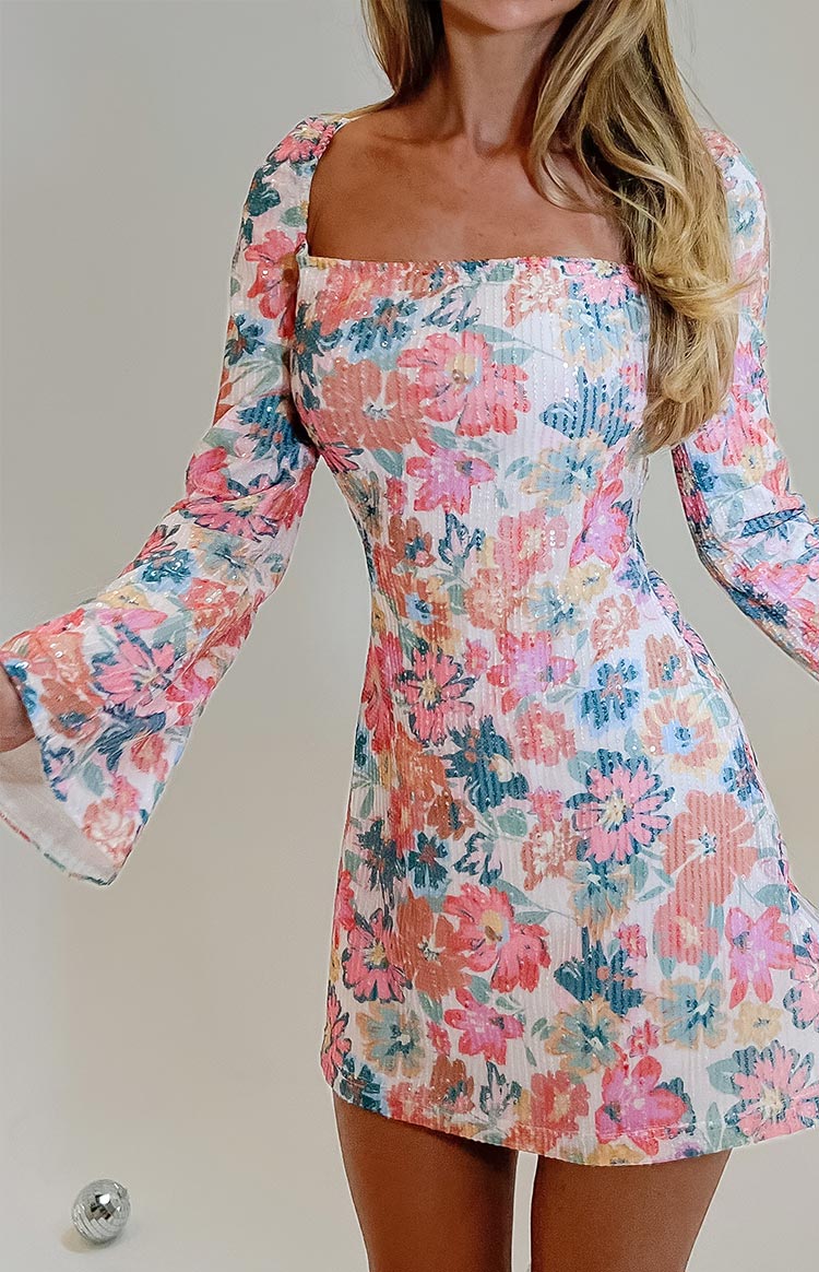 Close-up of the pink floral sequin mini dress showing the square neckline and long flared sleeves
