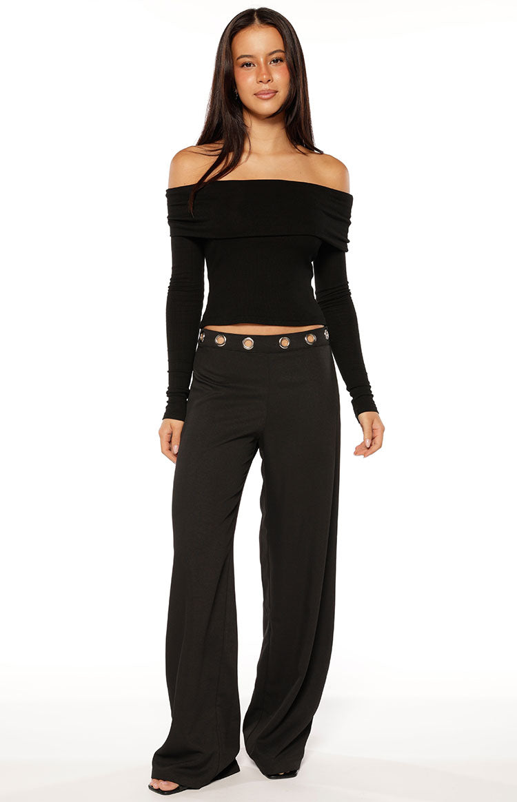 Black off-shoulder long sleeve top with a wide folded neckline and fitted silhouette