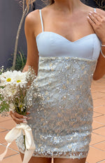 Close-up of the blue satin sweetheart neckline and sequin lace bodycon mini dress