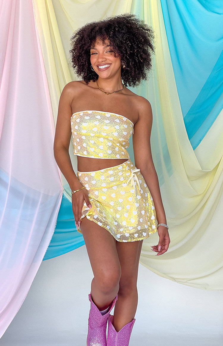Strapless yellow sequin top with white heart pattern