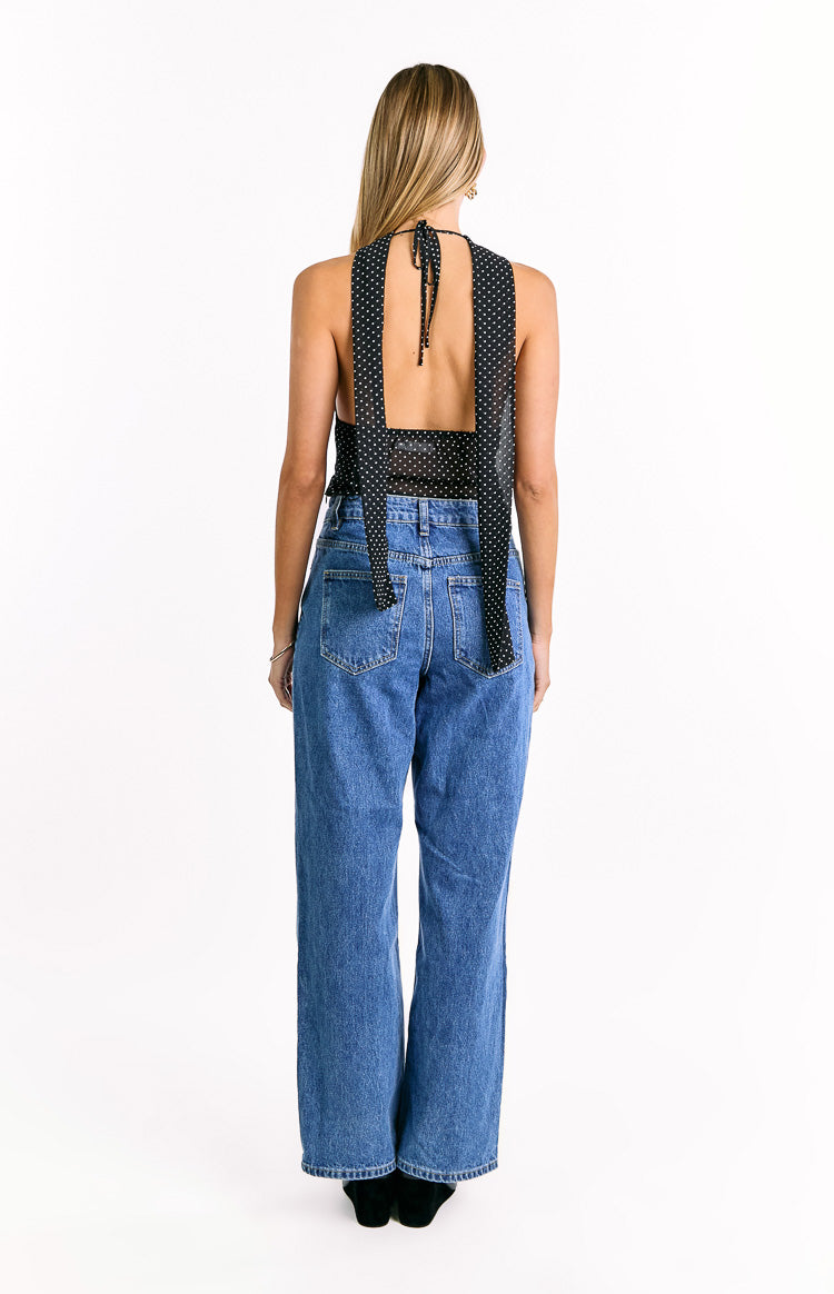Rear view of the black polka dot top with a tie-back halter neck and open back detail