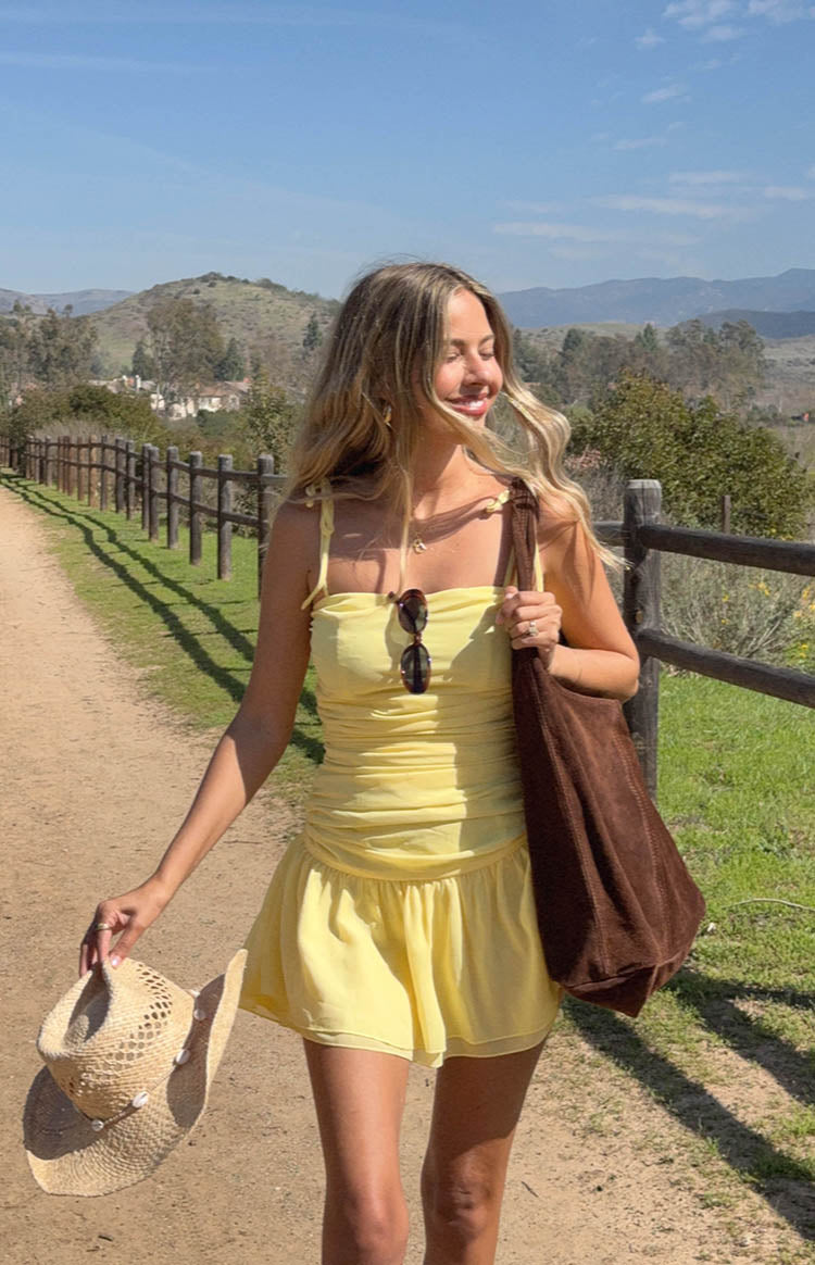 Beginning Boutique Milly Yellow Mini Dress yellow strapless ruched bodice mini dress with tie straps and a flowy skirt