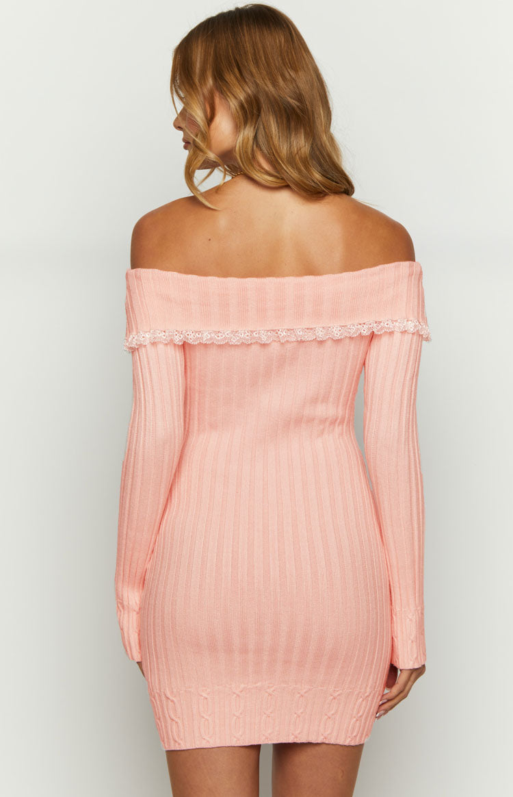 Rear view of a pink ribbed knit off-shoulder mini dress with delicate lace trim and cable knit hem