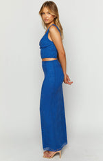 Side view of a textured blue lace maxi skirt, fitted through the hips