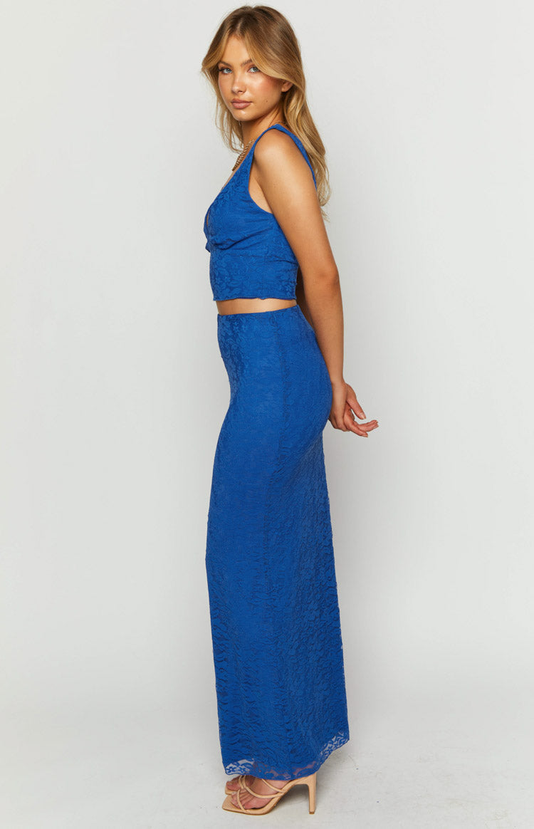Side view of a textured blue lace maxi skirt, fitted through the hips