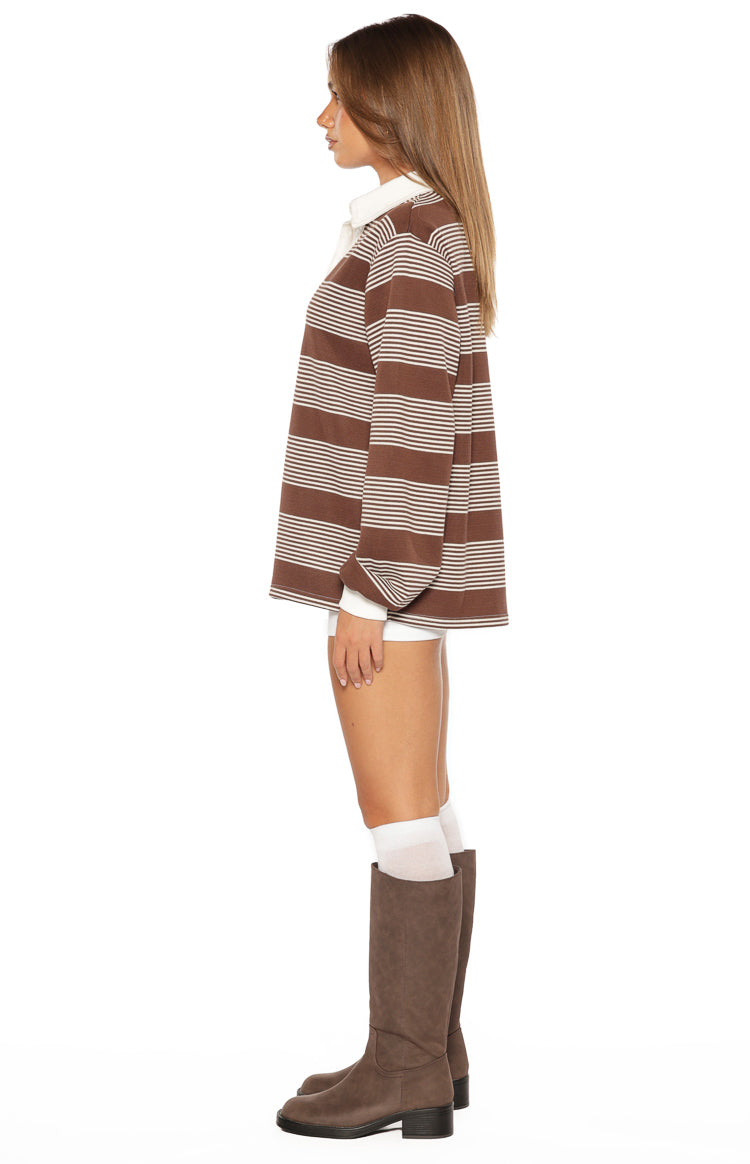 Side view of a brown and white striped polo shirt with a relaxed fit and long sleeves