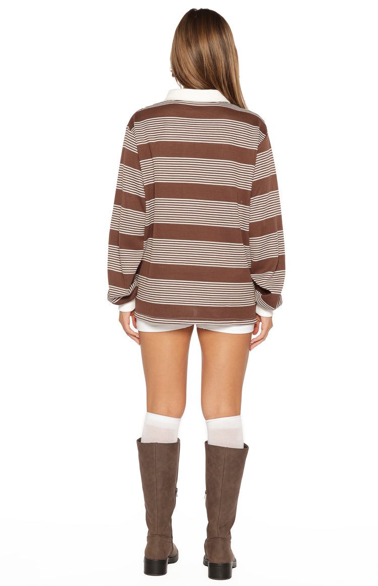 Rear view of the brown and white striped long-sleeve polo with a white collar and relaxed fit