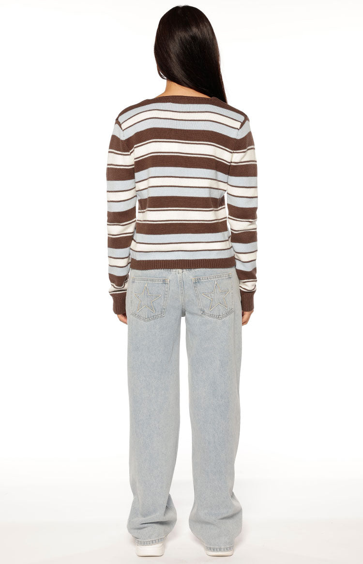 Rear view of the brown, white, and light blue striped knit cardigan with a simple crew neck and ribbed hem