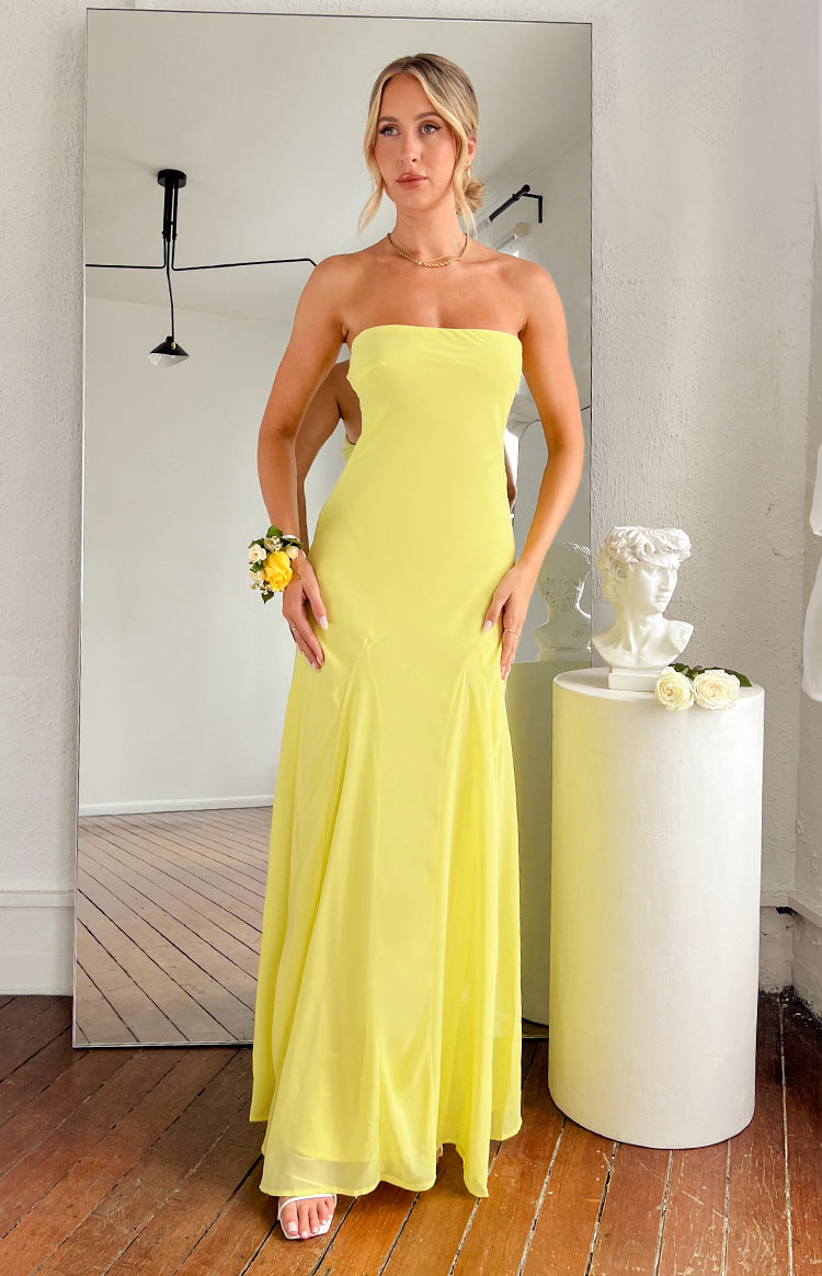 Beginning Boutique Myka Yellow Strapless Maxi Dress yellow strapless maxi dress with a fitted bodice and a flowing floor-length skirt