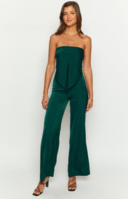 Full length view of teal wide-leg pants with a high-waisted fit and a flowing, lustrous fabric