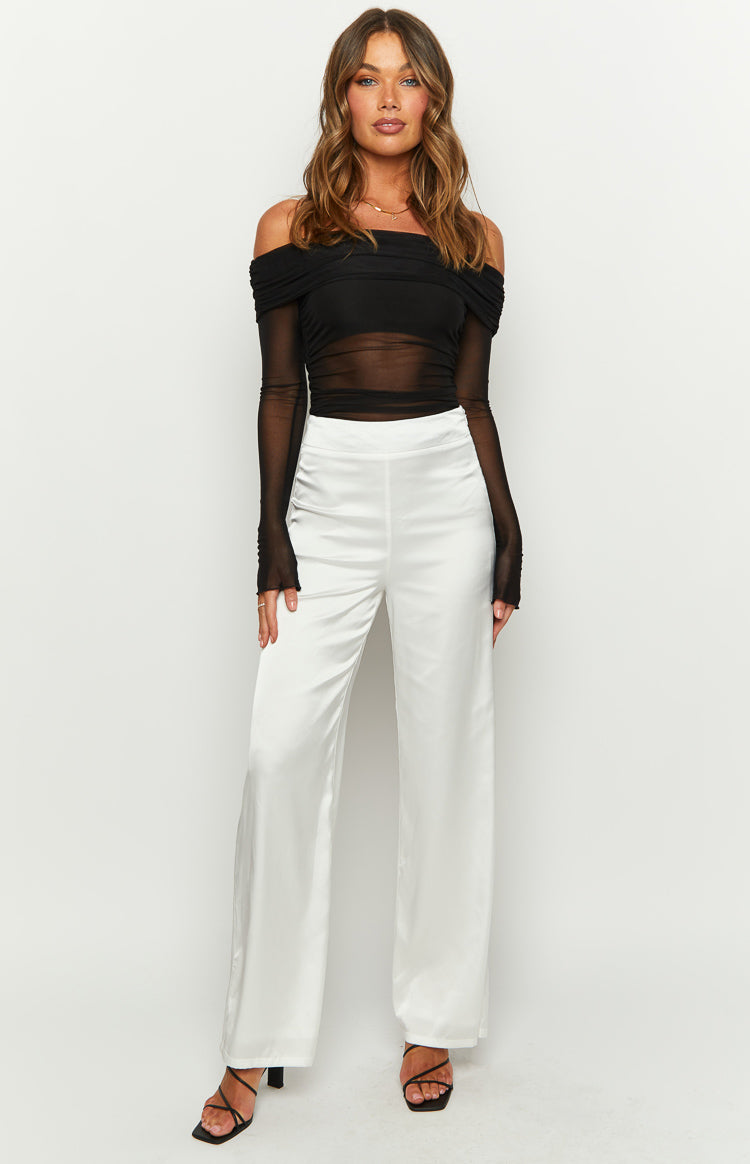 Front view of white satin wide-leg pants with a smooth high waistband and flowing drape