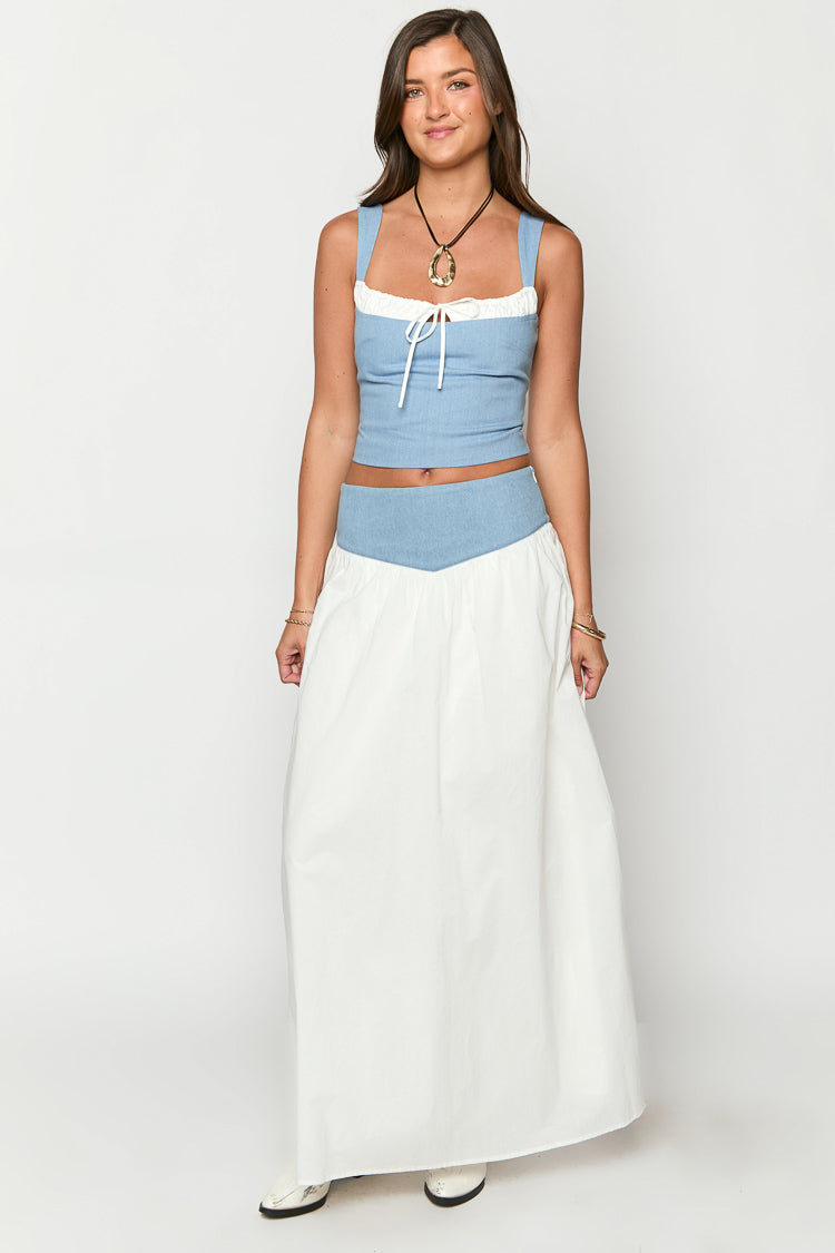 White maxi skirt with a light blue V-shaped waistband and a flowy silhouette