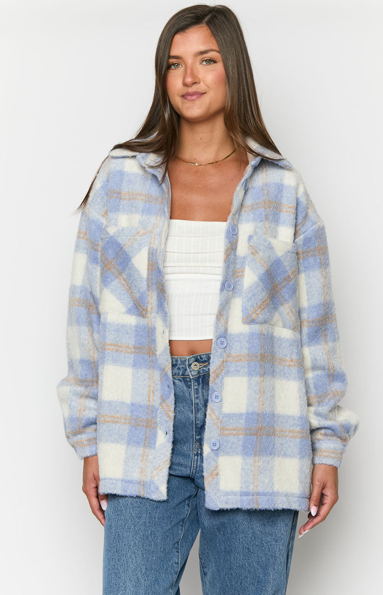 Open blue and white plaid jacket showing fuzzy texture, chest pockets, and light blue buttons
