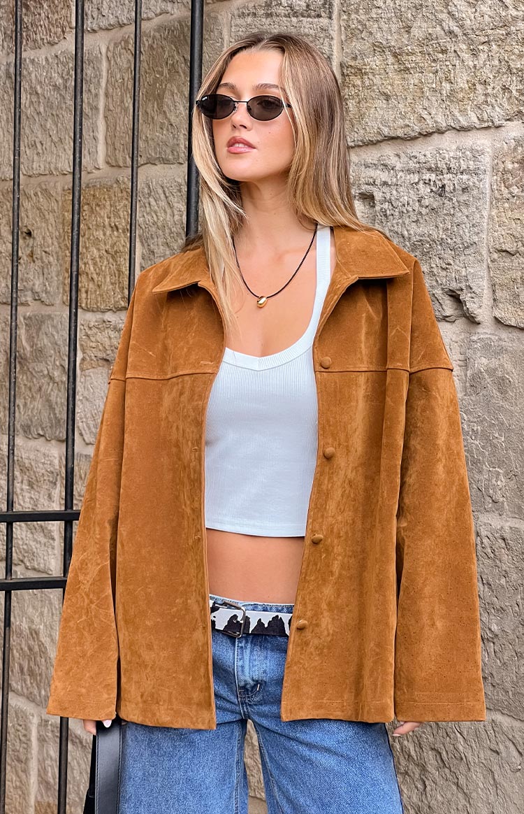 Tan suede oversized jacket with a classic pointed collar and visible front button placket