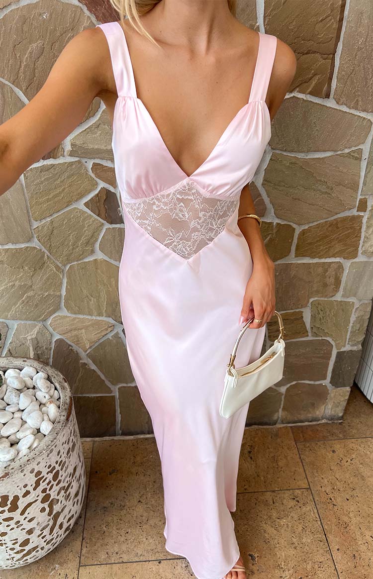 Light pink satin maxi dress with a deep V-neckline, gathered shoulder straps, and a sheer lace panel on the bodice