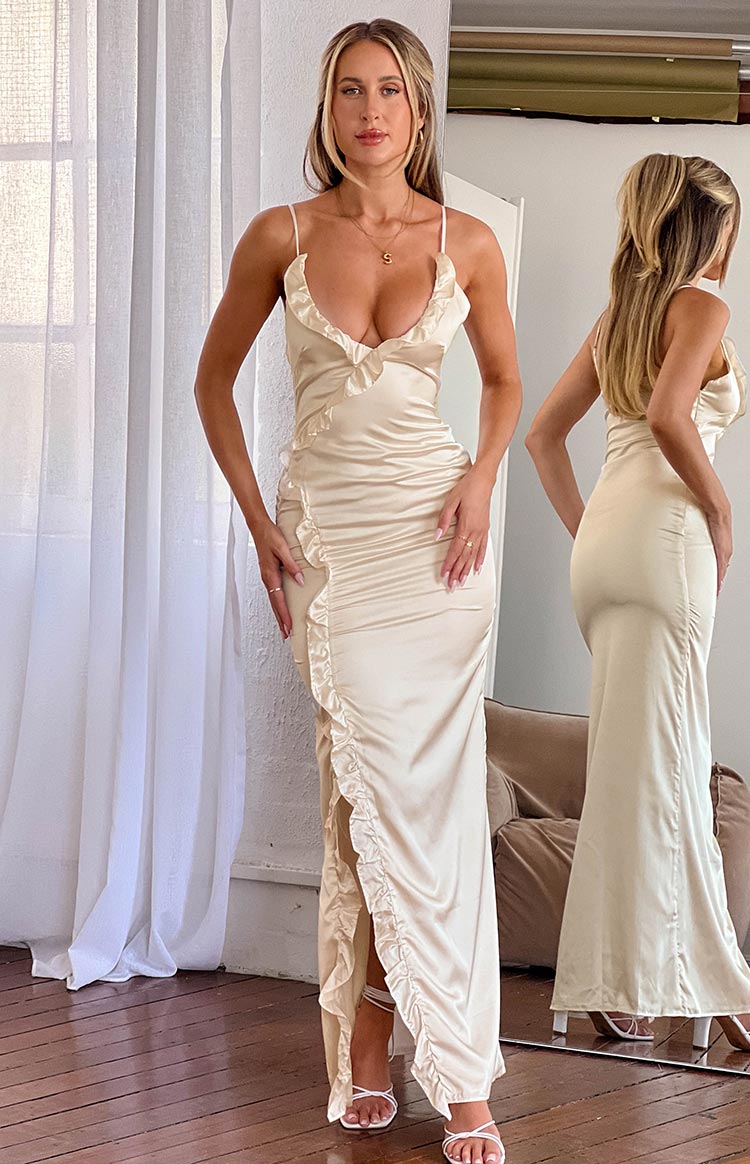 Beginning Boutique Nahanee Cream Satin Ruffle Maxi Dress cream satin deep V-neck maxi dress with spaghetti straps and side ruffle detail