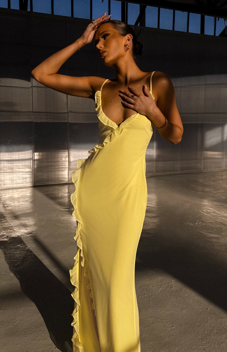Beginning Boutique Nahanee Yellow Ruffle Maxi Dress yellow V-neck spaghetti strap maxi dress with ruffles down the side and a slit
