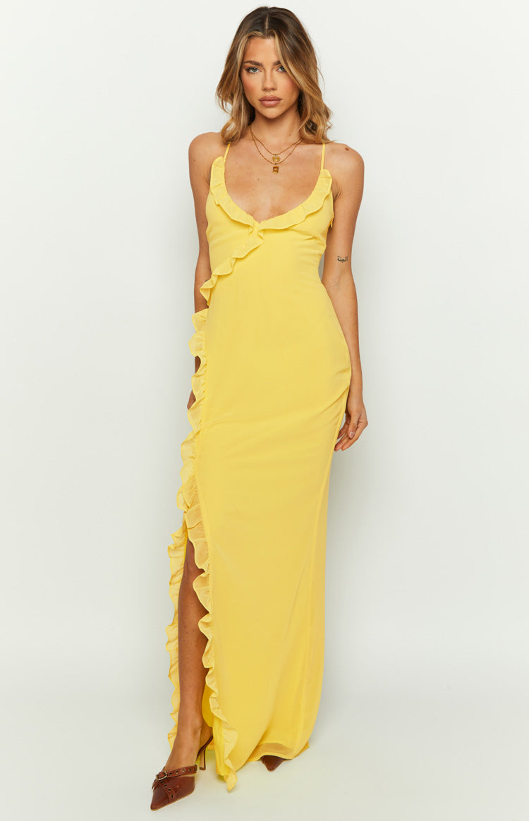 Front view of a yellow maxi dress with ruffled V-neck and a high side slit framed by ruffles
