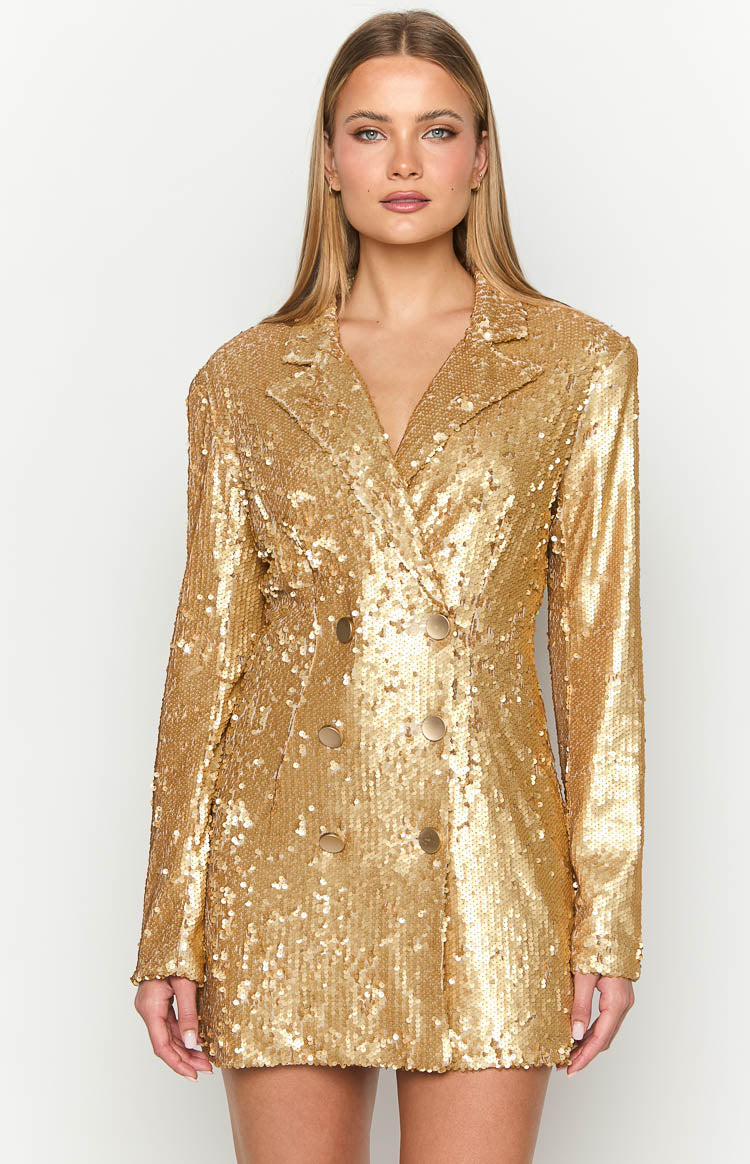Front view of a gold sequin blazer mini dress with notched lapels and double-breasted gold buttons