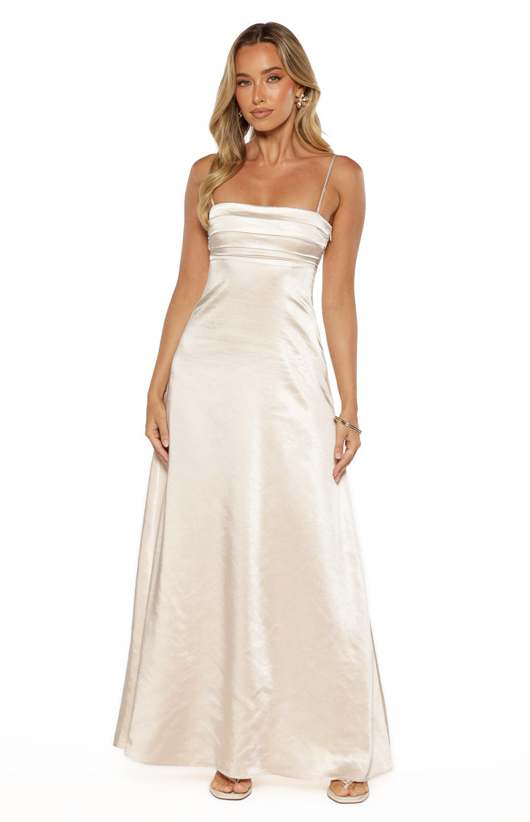 Front view of a cream satin maxi dress with a gathered straight neckline and subtle crinkle texture