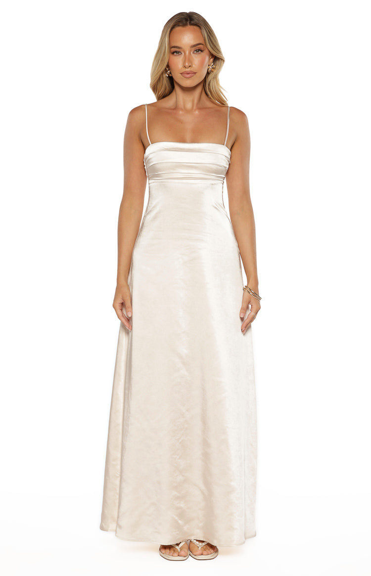 Front view of a cream satin maxi dress with a straight neckline, thin spaghetti straps, and horizontal bodice ruching