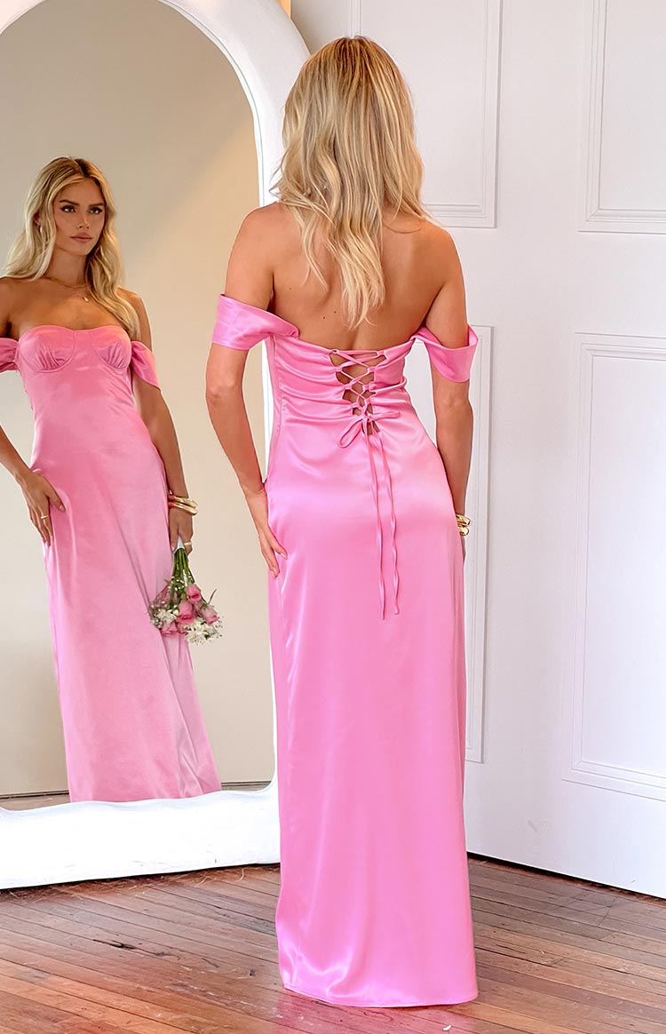 Rear view of a pink satin off-shoulder maxi dress with a corset-style lace-up back